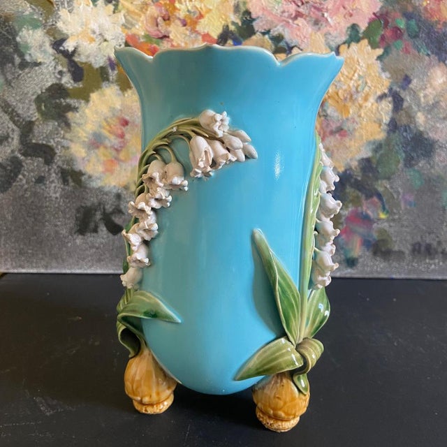 Small Antique Minton Majolica vase, with lily of the valley design and three sprouting bulb feet. Turquoise ground color...