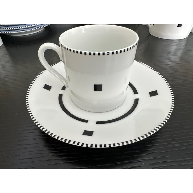 Bring home an icon of postmodern design with this rare, unused Swid Powell “Tuxedo” set: six full place settings (8 pieces...