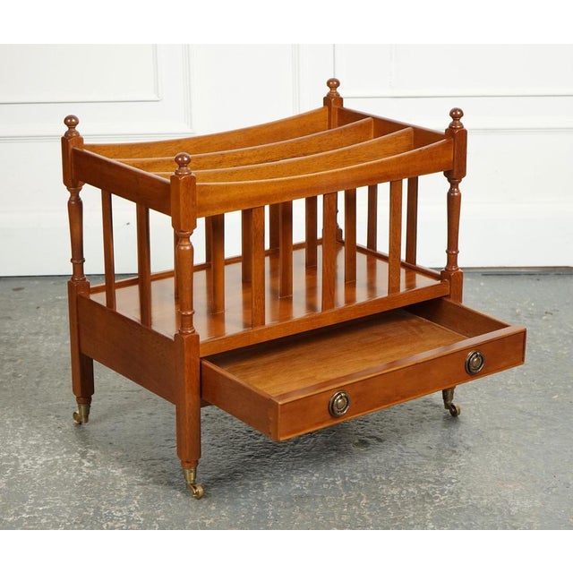 Lovely Vintage Yew Wood Canterbury Newspaper Rack. Typically features a classic design with a slatted construction to hold...