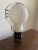 A whimsical and undeniably iconic oversized light bulb lamp, executed on a monumental scale and inspired by the playful...