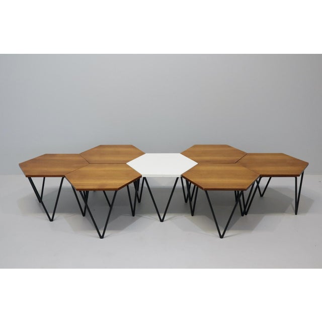 Set of seven modular coffee tables in metal, black Formica laminate, and oak, designed by Gio Ponti for I.S.A. Italia,...