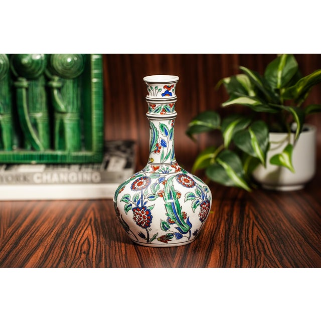 Capture the beauty and artistry of traditional Greek craftsmanship with this exquisite hand-painted decorative vase,...