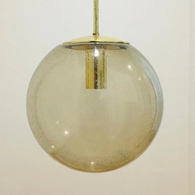 Stunning large mid-century glass ball pendant / ceiling light from limburg, germany, 1970s. Made of mouth blown smoked...