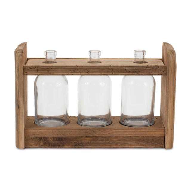 Add charm and rustic elegance to any room with the Triple Vase in Holder. Featuring three delicate glass bottle vases...