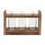 Add charm and rustic elegance to any room with the Triple Vase in Holder. Featuring three delicate glass bottle vases...