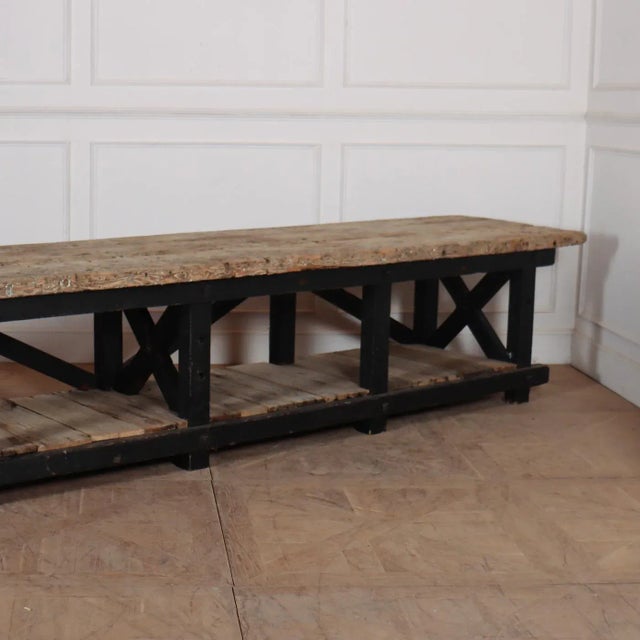 Monumental 19th Century pine display table. Originally a work table from an armoury. 1860s. This piece is designed in the...