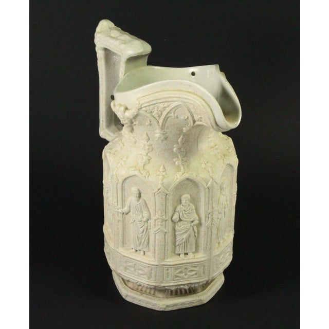 An impressive antique pottery jug or pitcher Exquisitely elaborated with amazing 3-dimensional detail stoneware vessel in...