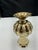 Vintage brass vase with rounded top, ribbed middle and pointed base. The vase has good weight and balance. The vase has...