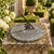 A classic vintage iron garden sundial inspired by traditional English estate landscapes reading, "Let others tell of...