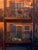 Anoop's Place by Raymond Bonilla | Oil on Panel Painting of a balcony with windows For Sale