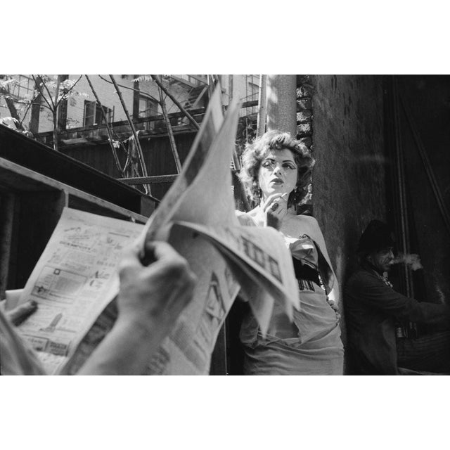 Actress In Greenwich Village View of an unidentified actress as she smokes a cigarette outside a theatre in Greenwich...