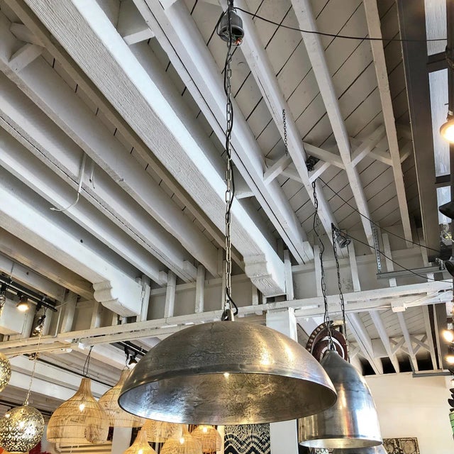 Nickel finish metal dome lantern with industrial style texture. Each slightly unique. Hanging chain and ceiling canopy...