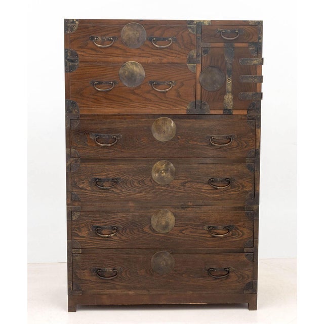 Korean Brass Mounted Elm Tansu, in three parts, two side slide drawers alongside small slide drawer and square cabinet...