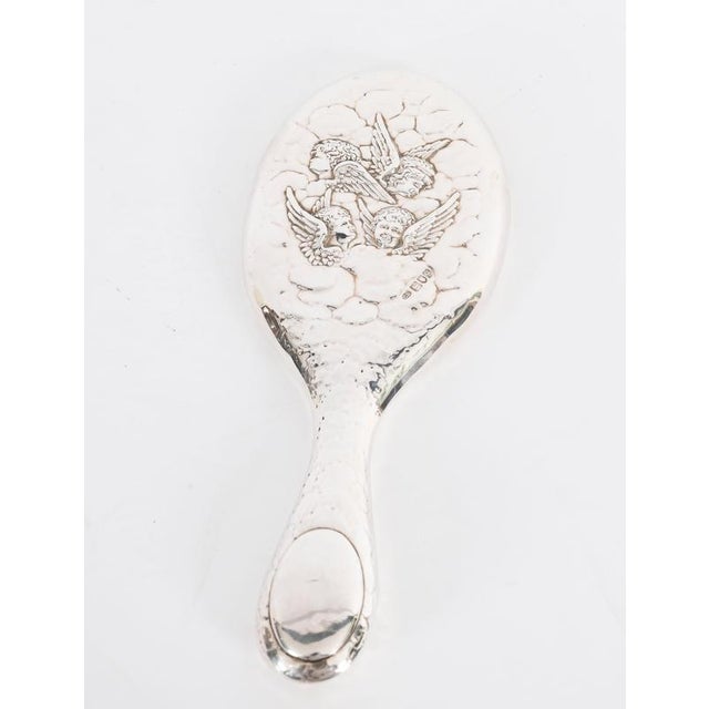 This is a wonderful antique Edwardian sterling silver hand-mirror with hallmarks for London 1902 and the maker's mark of...