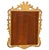 This is a mid-century Italian rococo revival carved giltwood mirror. It features a sort of shooting sunburst pediment, and...