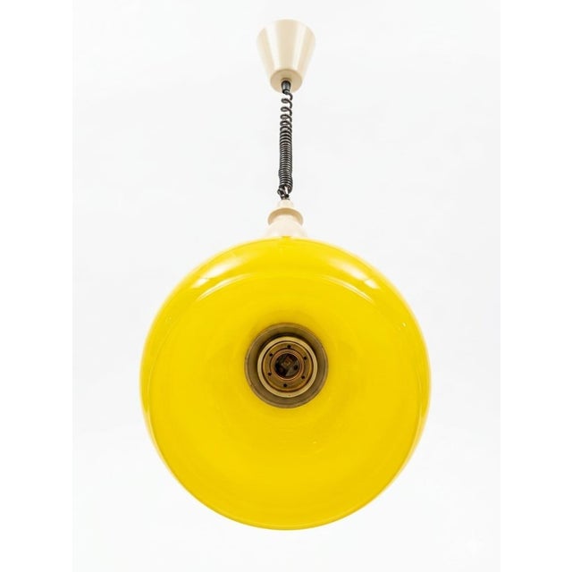 Vintage Yellow Opaline Glass Pendant Light with Spiral Cord, 1970s, in Very Good conditions. Designed 1960 to 1969 Up to...