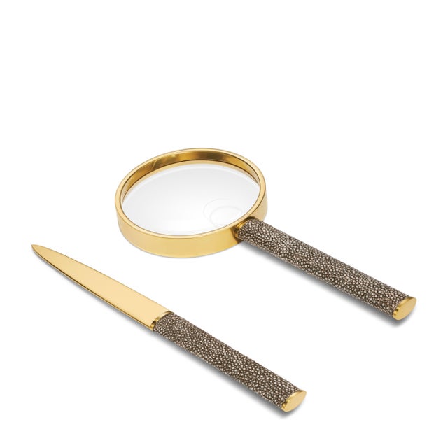 A matching magnifying glass and letter opener set that adds character to a desk. Crafted in faux shagreen and brass,...