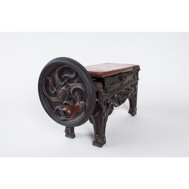 Mechanical Cast Iron Tobacco Cutter. Early 20th Century. German Embossed design with original bronze painted finish....
