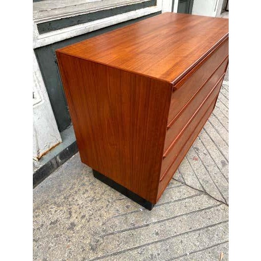 Norway Teak 4 Drawer Dresser with a plinth Black Base, most likely by Westnofa. Marked Norway on bottom of cabinet. Nice...