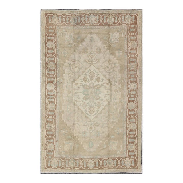 Mid 20th Century Mid 20th Century Turkish Vintage Oushak Medallion Rug With Muted Colors in Earth Tones For Sale
