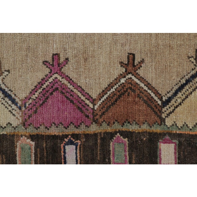 This gift-size vintage 2x3 Turkish rug, circa 1950–1959, features an architectural geometric design rendered in ivory,...