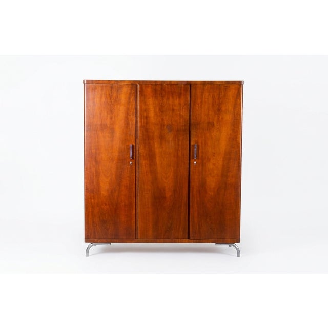 This three-door knockdown wardrobe is a unique testament to 1930s Czechoslovak Modernism, merging top-tier cabinetry with...