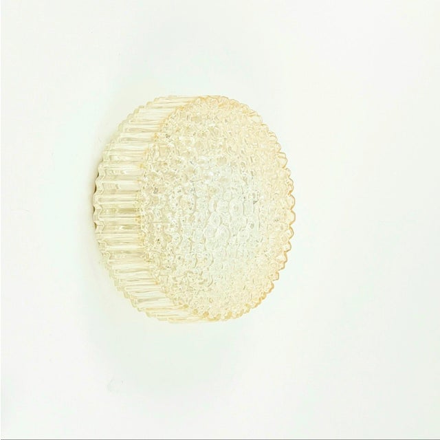 Stunning pair of mid-century modern light amber/champagne bubble glass wall lights by Helena Tynell for Limburg, one of...