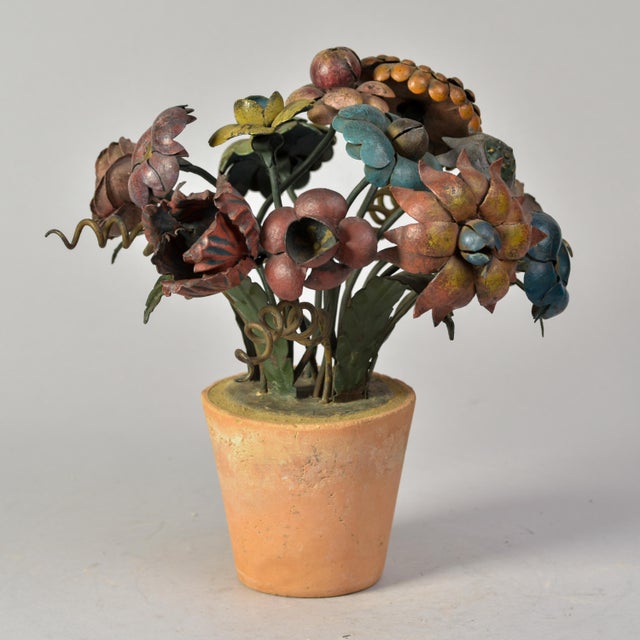 Found in France, these flower pots with metal tole flowers date from the early 1920s. Terracotta pots filled with cement...