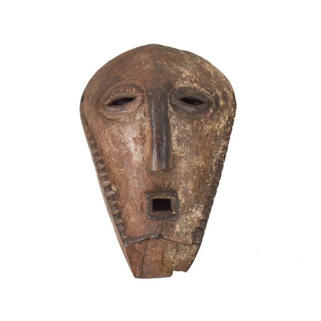 The Bembe Alunga Mask is an iconic artifact originating from the Bembe people of the Democratic Republic of the Congo....