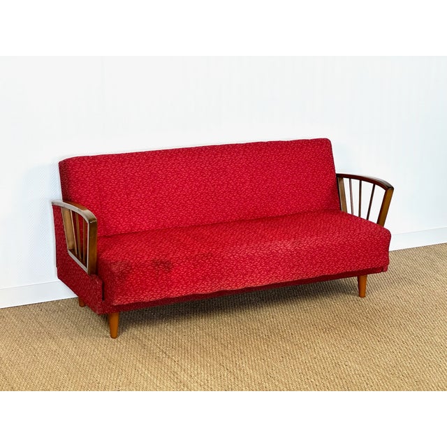 Stunning vintage sofa bed with a scandinavian design typical of the 1950s/60s. solid wood frame with slender spindle...