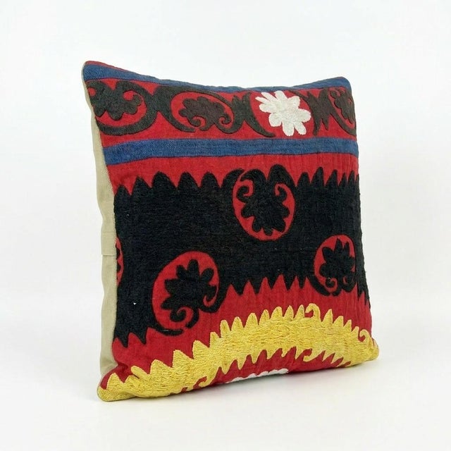 This beautiful 13'' x 13'' hand-embroidered Suzani pillow cover was made from authentic Uzbek cotton fabric. The intricate...