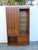 This brilliant Display Cabinet is made of wood, solid wood, walnut wood, walnut veneer, and glass. This Cupboard is an...