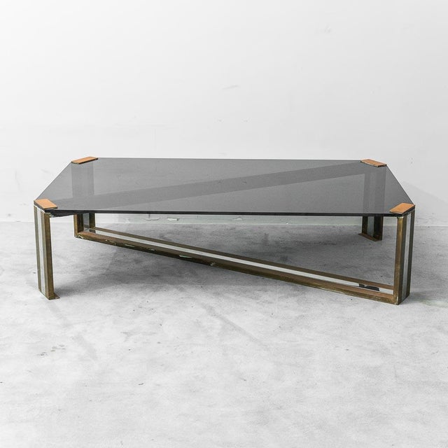 Coffee table. Brass and metal frame. Smoked glass top. Good condition, with signs of wear, as shown in photos.