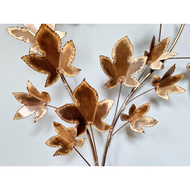 Large brass wall light, brutalist style, representing a branch with maple leaves, 1970s Very decorative sculptural object....
