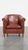 Offered is this stylish and elegant club chair made of cowhide leather with a luxurious finish with decorative rivets....