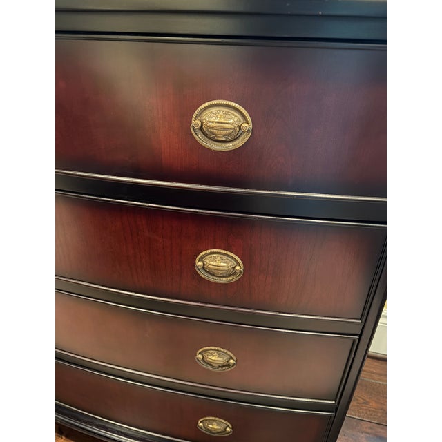 This elegant piece is a Hepplewhite Style 4-drawer bowfront dresser from The Bombay Company. It features a distinctive...