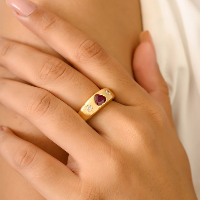 Luxury Heart Cut Ruby and Diamond Dome Band Ring in 18Kt Yellow Gold featuring 0.56 Ct heart-cut ruby at the center,...