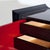 Bar cabinet by Gio Frigerio. Red lacquer doors and mirrored interior. Makers label affixed to back.
