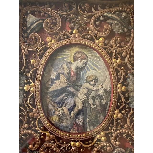 This item is an early 18th-century rolled paper, devotional reliquary box, featuring a central etching of the Virgin and...