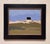 This artwork depicts a solitary Irish house set against a vast, open landscape characterized by soft, rolling hills and a...
