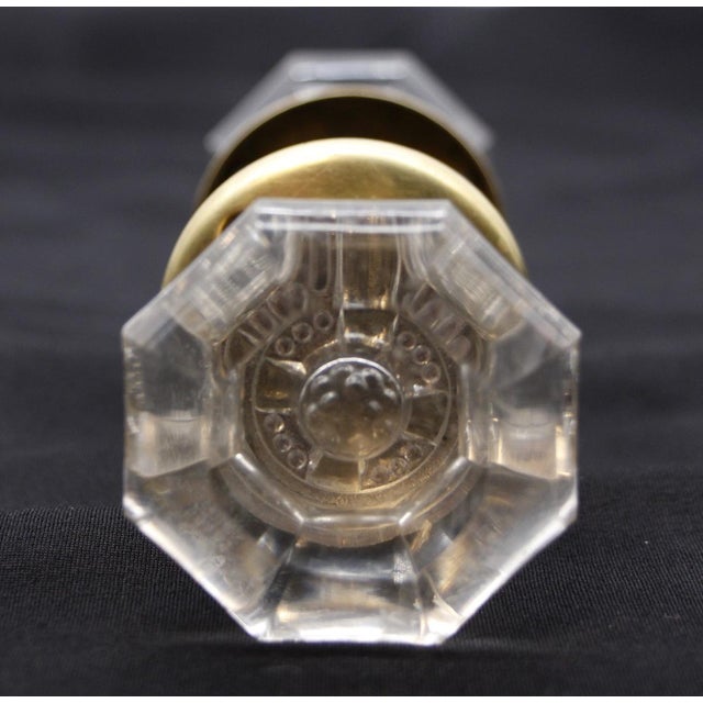 These octagon glass door knobs are concave in the center. The mercury center is a unique cross design. This set includes...