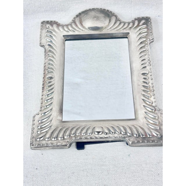 Lovely vintage silver plate frame with mirror. Perfect for a vanity table or dresser. Could also be used as a frame. This...