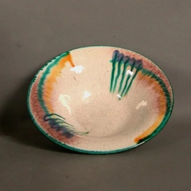 This Art Nouveau ceramic bowl with drip decor was made in Karlsruhe-Beiertheim, Germany.