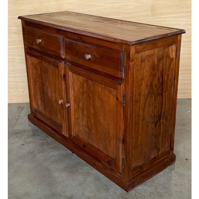 From Northern Spain, constructed of solid pine from Spain called "mobila", the rectangular top with molded edge atop a...