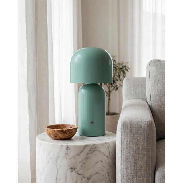 Illuminate your space with the Umbra accent table lamp, a beacon of minimalist modern style. Standing at a sleek 10 inches...