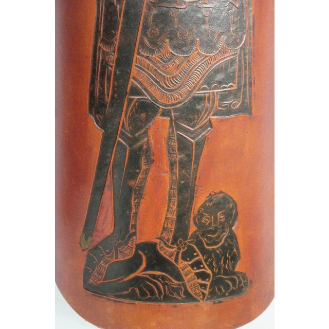 Pair of 1960s tooled leather mid evil curved wall plaques.