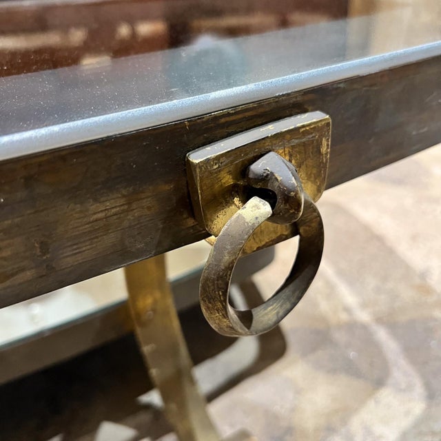 AMBIANIC presents Mexican Modern Long Coffee Table after Arturo Pani. Patinated Brass Rectangular with an oval shape....