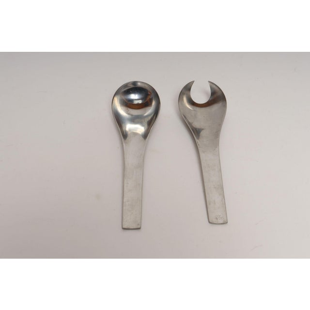 Modernist, sculptural salad servers/tongs in stainless steel designed by Svend Siune for Georg Jensen for the "Blue Shark"...