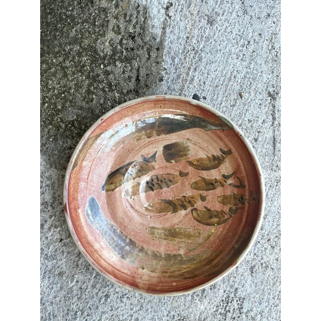 Brimming with organic charm and artistic expression, this vintage studio pottery bowl is a true one-of-a-kind find. The...