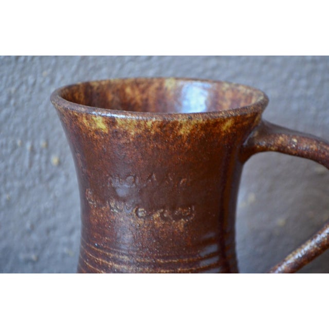 To complete your table setting or repurpose as a brutalist pitcher, this handled pot, with its thick, textured glaze, is a...